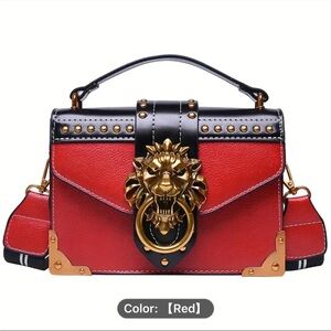 Elegant Red and Black Crossbody Bag with Lion Accent